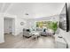 Spacious living room with hardwood floors, neutral decor, and an open concept layout at 707 63Rd S Ave, St Petersburg, FL 33705