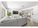 Open concept living space with neutral colors, hardwood floors, and ample natural light at 707 63Rd S Ave, St Petersburg, FL 33705
