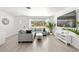Open-concept living room with hardwood floors, neutral tones, and bright, natural lighting at 707 63Rd S Ave, St Petersburg, FL 33705