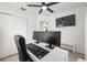 Dedicated home office space with a ceiling fan, a mounted TV, and a comfortable work environment at 707 63Rd S Ave, St Petersburg, FL 33705