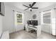 Bright home office with natural light, a modern desk setup, and a ceiling fan for comfortable working at 707 63Rd S Ave, St Petersburg, FL 33705