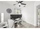 Bright office space featuring light gray flooring, white trim, and a ceiling fan for added comfort at 707 63Rd S Ave, St Petersburg, FL 33705