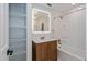 Bathroom featuring wood cabinets, tiled shower and bath at 7728 Balharbour Dr, New Port Richey, FL 34653