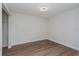 Empty bedroom with wood floors and white walls at 7728 Balharbour Dr, New Port Richey, FL 34653
