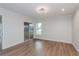 Bright bedroom with wood floors and glass doors to lanai at 7728 Balharbour Dr, New Port Richey, FL 34653