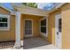Covered front porch with security door at 7728 Balharbour Dr, New Port Richey, FL 34653