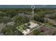 Aerial view of the home set in a tree-lined neighborhood at 837 Greenbelt Cir, Brandon, FL 33510