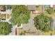 An aerial view of a home nestled among mature trees in a residential area at 837 Greenbelt Cir, Brandon, FL 33510