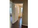 Bathroom featuring tiled shower and white door at 837 Greenbelt Cir, Brandon, FL 33510