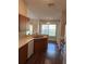 Efficient kitchen features laminate counters, wood cabinets, stainless sink and a bright breakfast nook at 837 Greenbelt Cir, Brandon, FL 33510