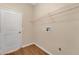 Laundry room with ample storage, washer and dryer hookups, and white door at 837 Greenbelt Cir, Brandon, FL 33510