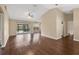 Open-concept living area with wood-look flooring and sliding glass doors leading to the backyard at 837 Greenbelt Cir, Brandon, FL 33510