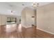 Open-concept living room and dining area with wood floors and natural light at 837 Greenbelt Cir, Brandon, FL 33510