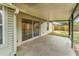 The home has a covered patio with concrete slab at 837 Greenbelt Cir, Brandon, FL 33510