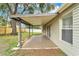 This partially covered patio has a metal roof and support beams at 837 Greenbelt Cir, Brandon, FL 33510