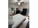 Spacious bedroom with hardwood floors, soft natural light, and dresser at 4924 Creekside Trl, Sarasota, FL 34243