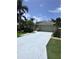 Charming single-story home with well-maintained landscaping, lush tropical plants and a two car garage at 4924 Creekside Trl, Sarasota, FL 34243