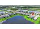Aerial view of home surrounded by lakes, green spaces, and neighborhood amenities at 6256 Baywood Ct, Bradenton, FL 34211