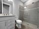 A bathroom featuring a glass enclosed shower, tile and vanity with sink at 6256 Baywood Ct, Bradenton, FL 34211