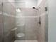 A glass shower enclosure with decorative tile at 6256 Baywood Ct, Bradenton, FL 34211