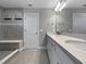 Modern bathroom showcasing a double vanity with quartz countertops and sleek fixtures at 6256 Baywood Ct, Bradenton, FL 34211