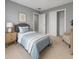 Cozy bedroom featuring a twin bed, nightstand, and ample closet space at 6256 Baywood Ct, Bradenton, FL 34211