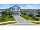 Attractive two-story home with a paved driveway and well-manicured front yard at 6256 Baywood Ct, Bradenton, FL 34211