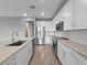 A modern kitchen featuring stainless steel appliances and white cabinets at 6256 Baywood Ct, Bradenton, FL 34211