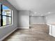 Open floorplan with wood flooring and view from window at 6256 Baywood Ct, Bradenton, FL 34211