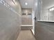 Tiled shower area complete with a built-in bench, mosaic accent tile, and a glass partition at 6256 Baywood Ct, Bradenton, FL 34211
