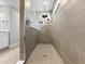 Modern tiled shower featuring a rain shower head and hand-held sprayer with built in niche at 6256 Baywood Ct, Bradenton, FL 34211