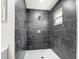 Modern bathroom features stylish tile and a new shower at 7341 Hart St, Englewood, FL 34224