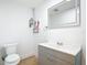 Modern bathroom with vanity, mirror, and sleek fixtures at 7341 Hart St, Englewood, FL 34224