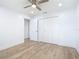 Bright bedroom with modern ceiling fan, wood floors, and double door closet at 7341 Hart St, Englewood, FL 34224