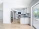 Bright, open kitchen boasts modern appliances and sleek black countertops at 7341 Hart St, Englewood, FL 34224