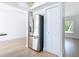 Bright kitchen featuring stainless steel refrigerator and ample storage at 7341 Hart St, Englewood, FL 34224