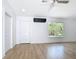 Bright room featuring an air conditioner and a large window with outdoor views at 7341 Hart St, Englewood, FL 34224