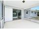 A screened in lanai patio with sliding glass doors to the interior at 7341 Hart St, Englewood, FL 34224