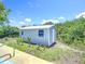 A side view of a shed with an out door pathway at 7341 Hart St, Englewood, FL 34224