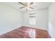 This is a bedroom with hardwood floors and natural light at 7716 Nottinghill Sky Dr, Apollo Beach, FL 33572