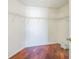 Walk-in closet featuring wood flooring and white wire shelving for ample storage at 7716 Nottinghill Sky Dr, Apollo Beach, FL 33572