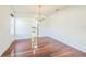 Dining room with hardwood floors, chandelier, and natural light at 7716 Nottinghill Sky Dr, Apollo Beach, FL 33572