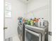 Modern laundry room featuring updated appliances and ample storage space at 7716 Nottinghill Sky Dr, Apollo Beach, FL 33572