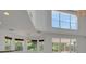 This living room boasts lots of natural light and recessed lighting at 7716 Nottinghill Sky Dr, Apollo Beach, FL 33572