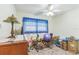 Bright bedroom featuring a ceiling fan and large window with natural light at 8490 7Th Ln N,, St Petersburg, FL 33702