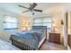 Comfortable bedroom featuring a ceiling fan and two bright windows at 8490 7Th Ln N,, St Petersburg, FL 33702