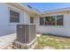 The house's exterior has an air conditioning unit sitting on a concrete slab next to the house at 8490 7Th Ln N,, St Petersburg, FL 33702