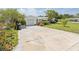 Wide driveway leads to attached single-car garage of this charming single-story house at 8490 7Th Ln N,, St Petersburg, FL 33702