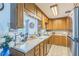 Kitchen featuring wood cabinetry, modern appliances, and plenty of counter space at 8490 7Th Ln N,, St Petersburg, FL 33702