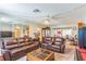 Spacious living room featuring a large sofa set and open layout at 8490 7Th Ln N,, St Petersburg, FL 33702